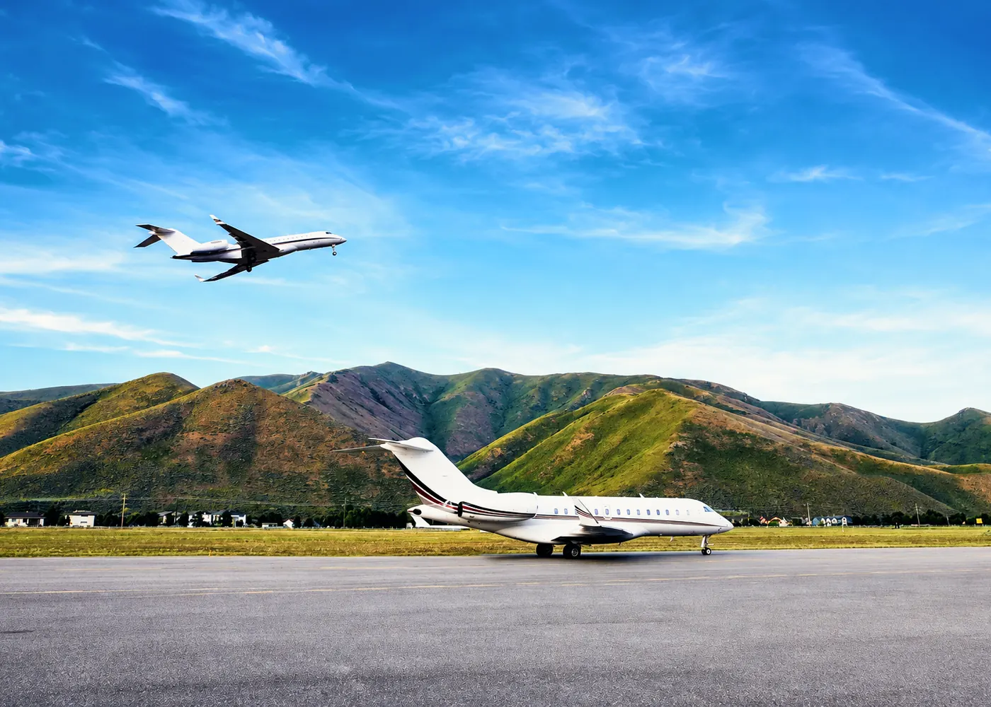 AvidJet aircraft against a mountain backdrop