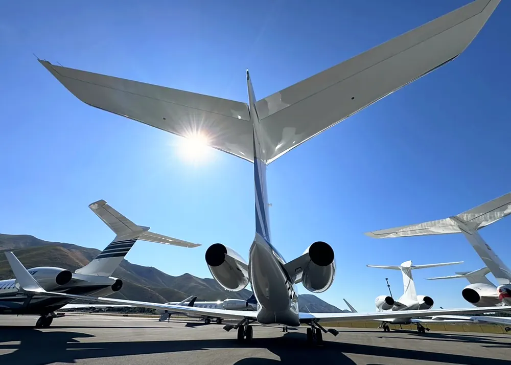 Corporate aircraft on the ramp outside a flight department hangar